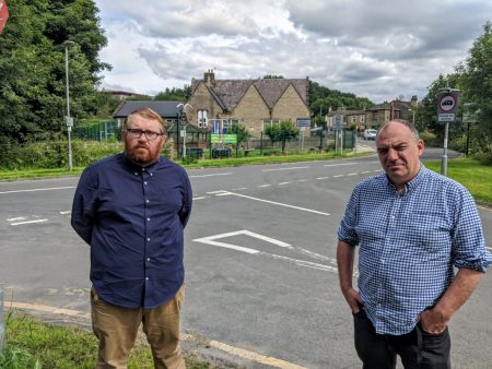 Councillor Andrew Cooper and Matt Edwards standing in front of the junction outside Woodlands Primary School
