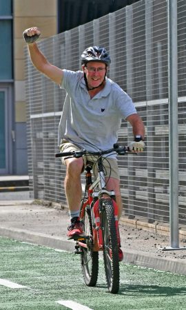 Councillor Martin Love on a new cycle lane in Bradford