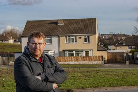 Matt Edwards standing in front of a semi-detached house on Fairfax Avenue, Bierley.