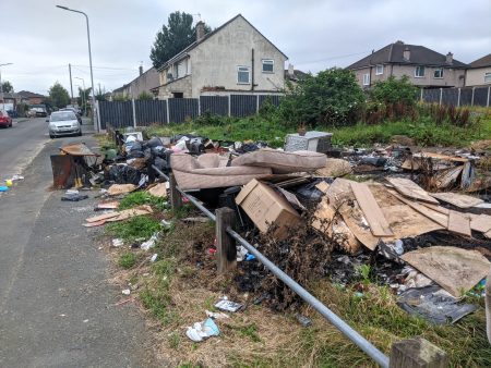 A large pile of fly tipping in the land at the corner of Fairfax Avenue and Hyne Avenue in Bierley, Bradford
