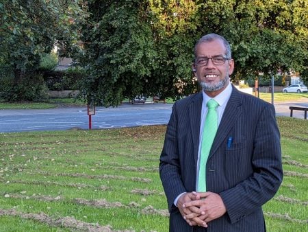 Khalid Mahmood stood on an area of Green Space in Heaton Ward