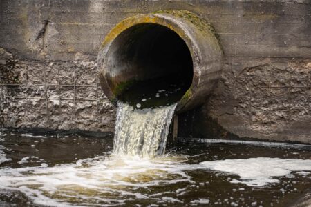 An open sewer discharging into a local river