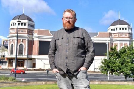 Matt Edwards standing in front of Bradford Live (the former Odeon building)