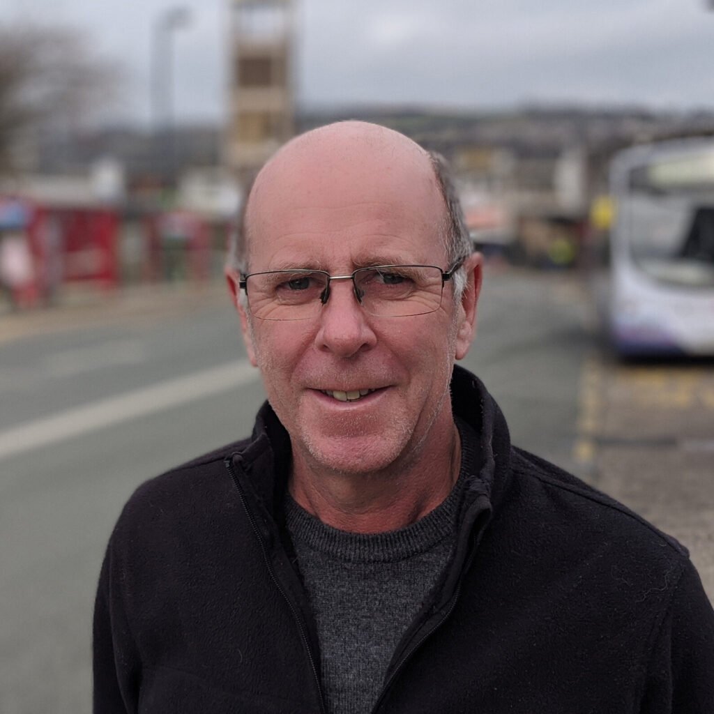 Green Party Councillor Martin Love standing in Shipley Market Place