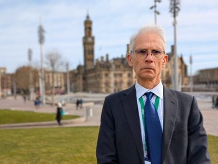 Councillor Neil Whitaker stood outside Bradford City Hall.